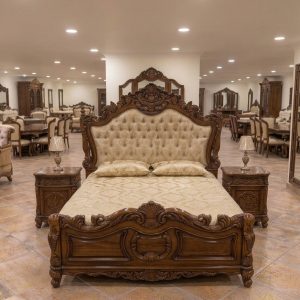 Luxury Chinioti handmade wooden bed set with intricate hand carving and tufted headboard in a showroom
